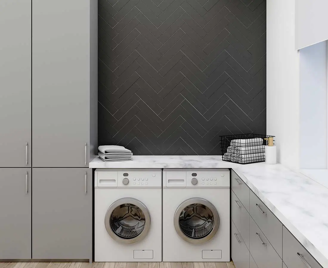 Custom laundry with folding station and overhead cabinetry, Sydney